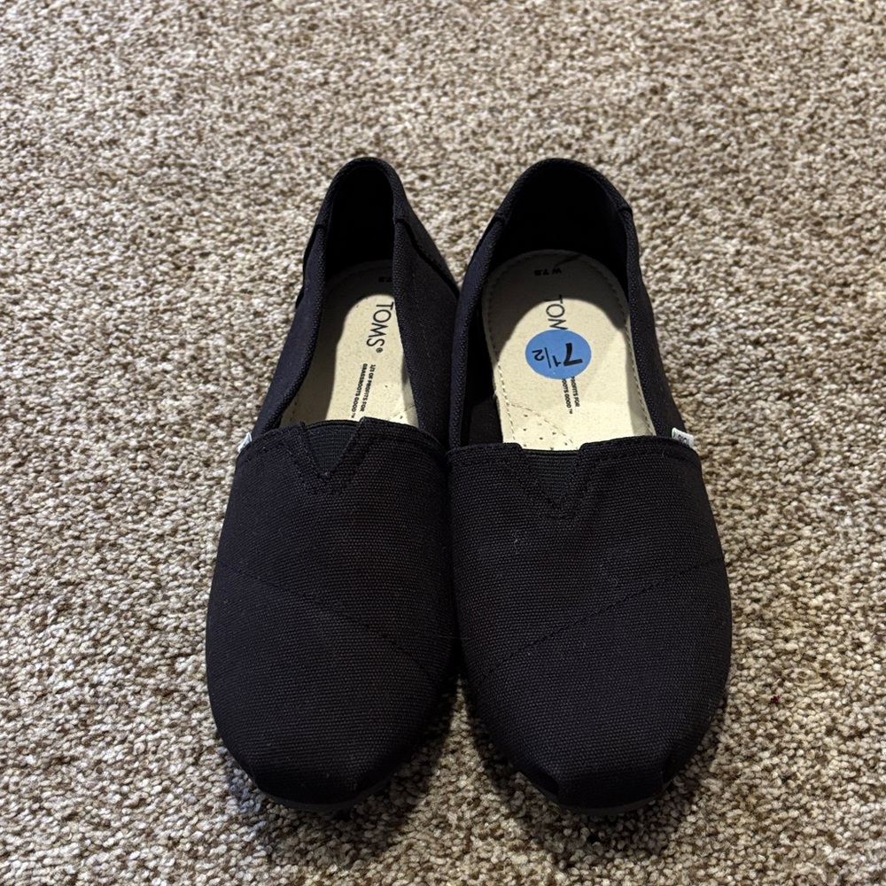 TOMS Black Canvas Slip-Ons